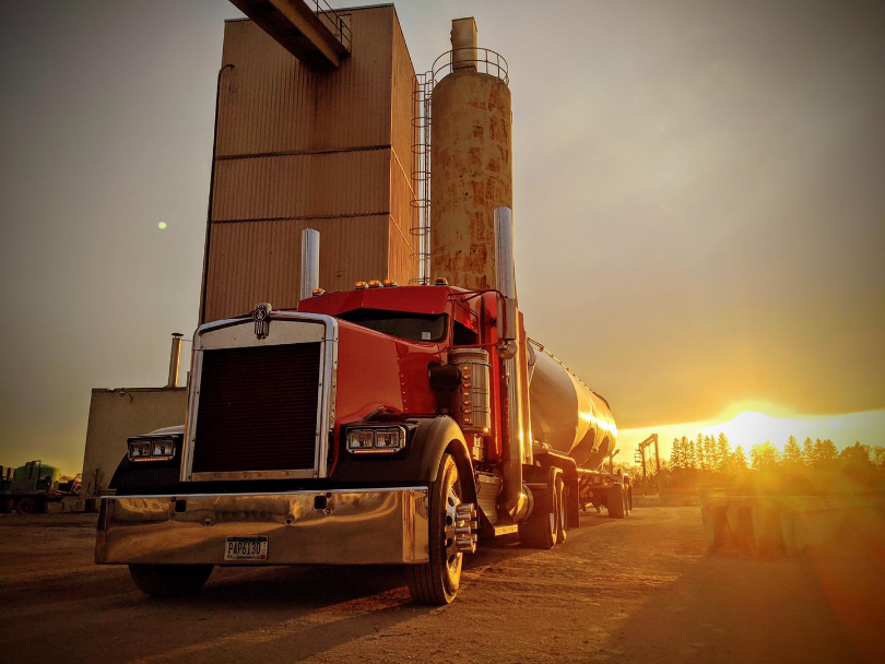 Truck parked at LeFebvre Bulk Transport in Elk River, Minnesota at sunset.